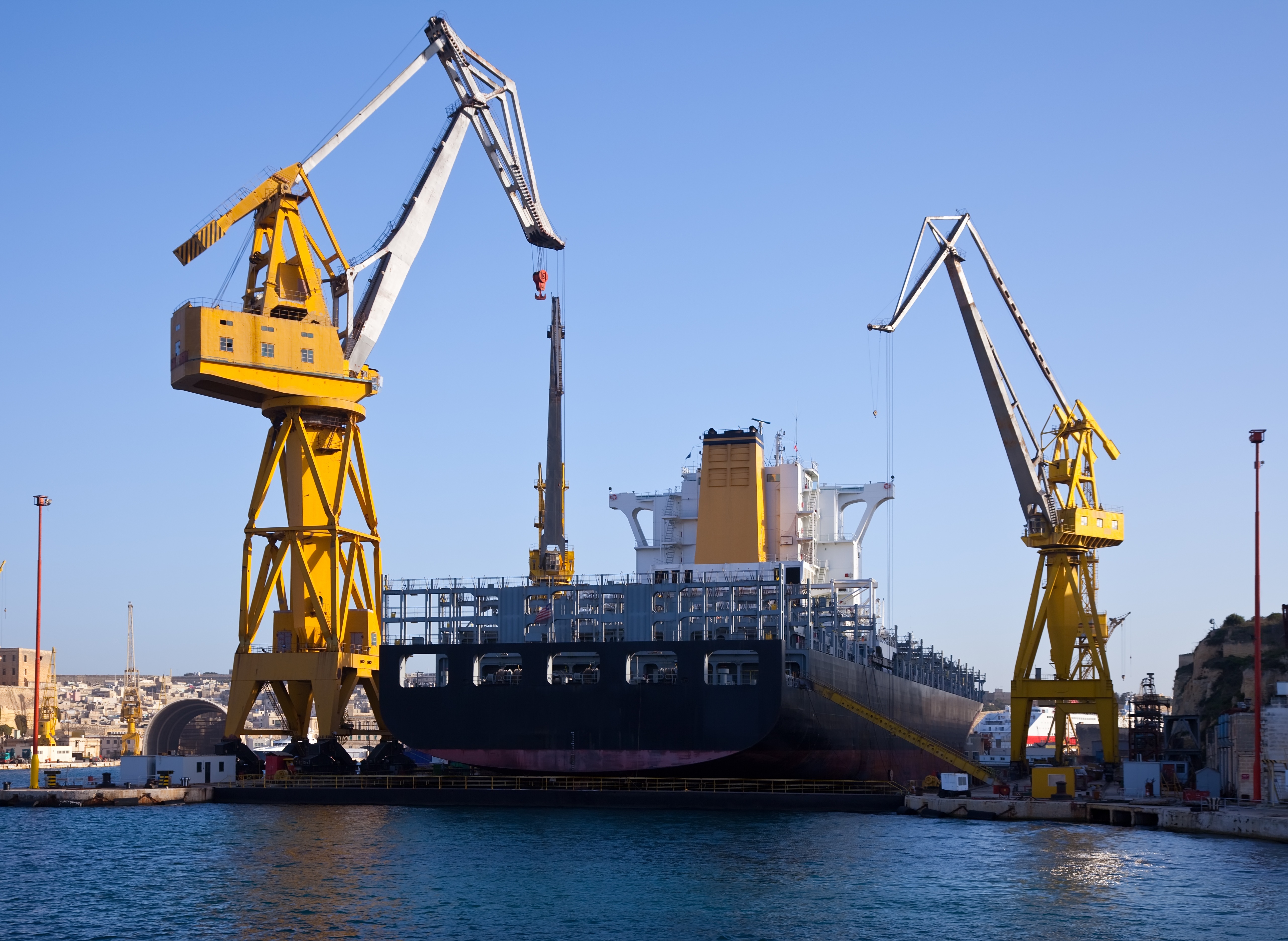 Crew managing offshore cargo for a marine logistics company in Singapore